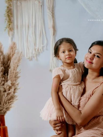 A lovely portrait of a mother and daughter from their specially curated Mother's Day session. The soft, neutral tones of the boho theme create a timeless look.