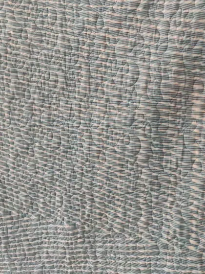 A detail shot of the quilting texture on the back.