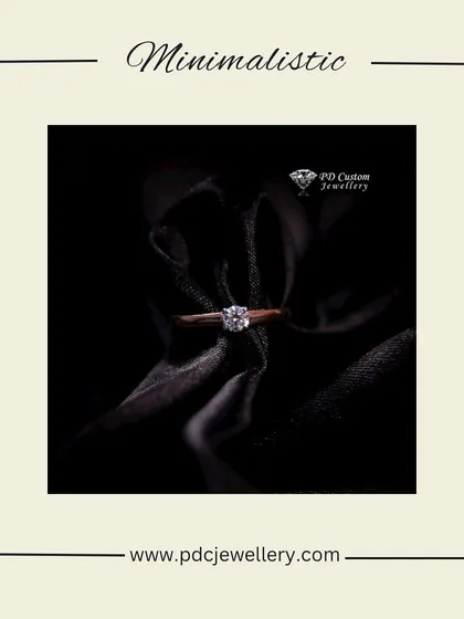 A minimalist and modern solitaire ring. This piece is perfect for someone who appreciates understated elegance, with a single beautiful diamond set in a simple rose gold band.