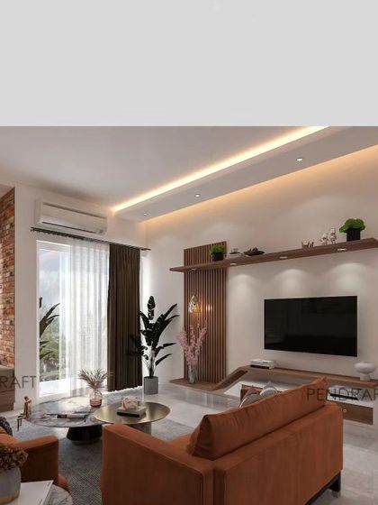 The accompanying drawing room, featuring a comfortable L-shaped sofa in a warm terracotta color and a sleek, wall-mounted TV unit with integrated shelving.