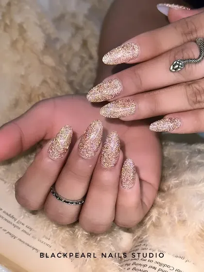 Another view of the flash glitter nails, showing how they catch the light to create a brilliant, diamond-like effect.