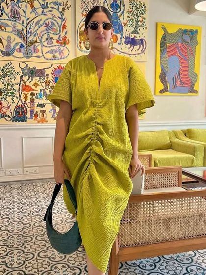 Another beautiful styling of the Selena in Forest Green, proving its ability to complement a wide range of colors and styles, from bold prints to monochrome looks.