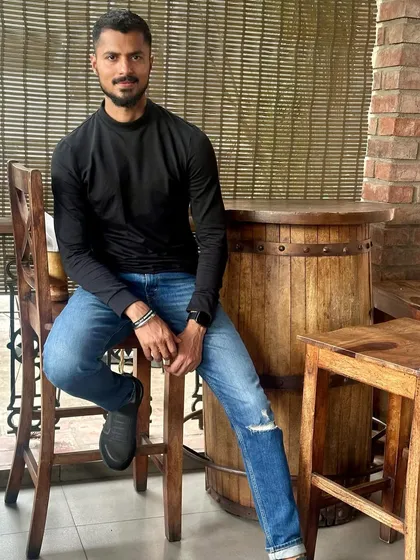 A full-length shot of my casual cafe look, showing my personal style.