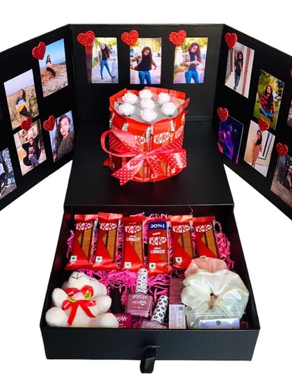 A surprise box designed for her, filled with all her favorite things. It includes a photo wall, a chocolate cake, nail polish, scrunchies, and a cute teddy bear.