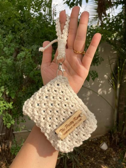 Our mini wallet comes with a small wristlet strap, making it easy to carry on its own. It's available in 12 different colors.