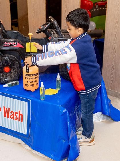 An interactive 'Car Wash' station where the birthday boys could clean their toy cars. It's these unique, hands-on activities that make a party special.
