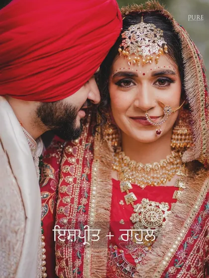A close-up portrait that is both intimate and regal. The bride's beautiful smile and the groom's gentle presence make this a timeless Sikh wedding photograph.