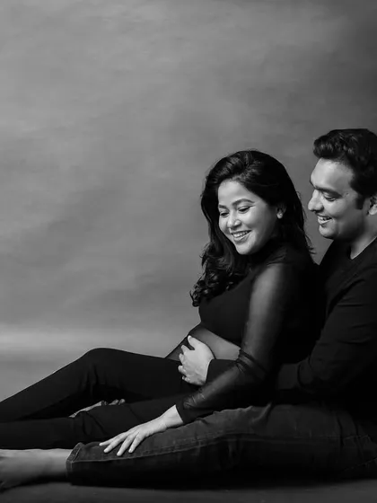 The same intimate couple's pose, rendered in timeless black and white to emphasize their connection.