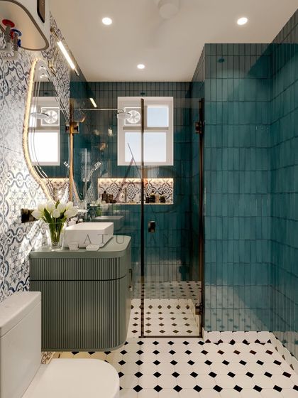 A bathroom with a bold personality, featuring vibrant blue and white patterned tiles, teal subway tiles in the shower, and a modern ribbed vanity.