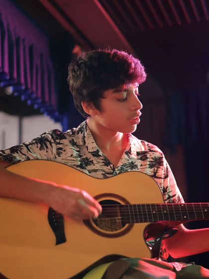 An acoustic guitarist captivates the audience with his performance. Whether it's electric rock or acoustic melodies, our program covers a wide range of styles.