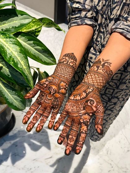 This design combines different traditional elements, with peacocks on one hand and intricate floral patterns on the other, showing my versatility in custom designs.