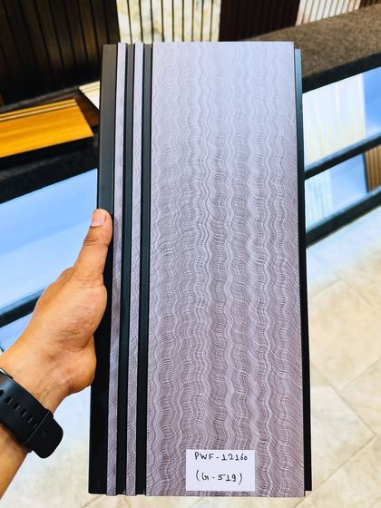 A new pattern in our fluted panel collection. This design has a unique wavy texture in a soft grey color, adding a gentle, organic feel to the wall.