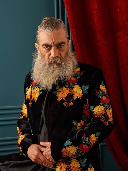 A closer look at the rich, colorful floral embroidery on our velvet sherwani. The texture of the velvet combined with the detailed threadwork creates a look of pure opulence and artistry.