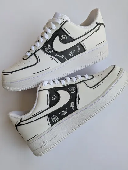 It's not always about bright colors. This monochrome doodle style is perfect for telling your personal story in a clean, cartooned way. We can add symbols for your hobbies, passions, or life moments, like the Pink Floyd and gaming icons on this pair.