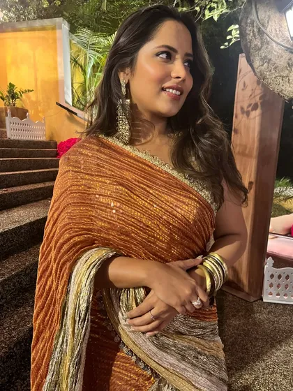 A close-up of my Qawwali night look. The warm tones of the saree and the chunky gold bangles created a perfect festive combination.