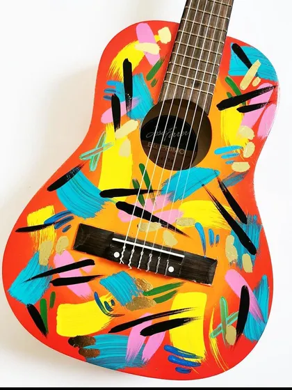 Art isn't just for your closet. I transformed this acoustic guitar with a vibrant, abstract design using bold brushstrokes and a dynamic color palette. This service is perfect for musicians who want their instrument to be as unique as their sound.