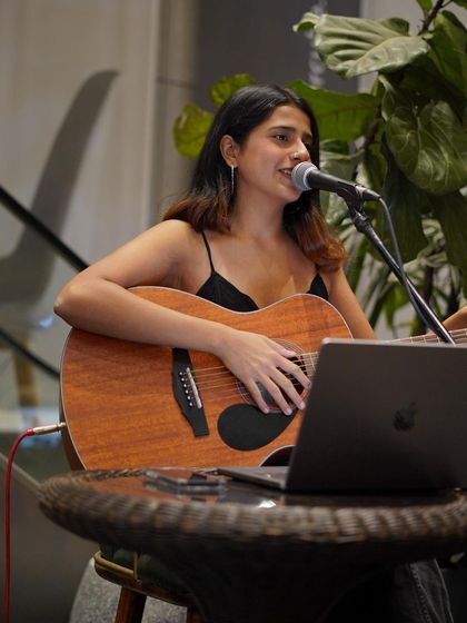 My laptop with lyrics, my guitar, and a microphone. The simple setup for an intimate acoustic session.