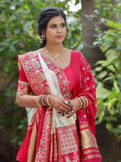 Another elegant shot of her puja look, highlighting the intricate saree and the simple, clean makeup that enhances her features.