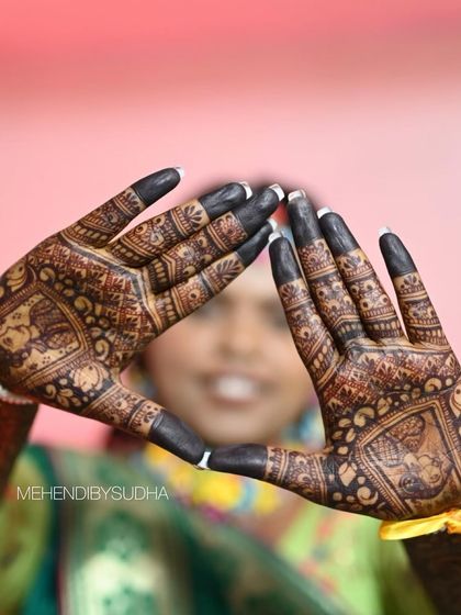 A creative pose showing the back of the hands, with the stain looking dark and beautiful.
