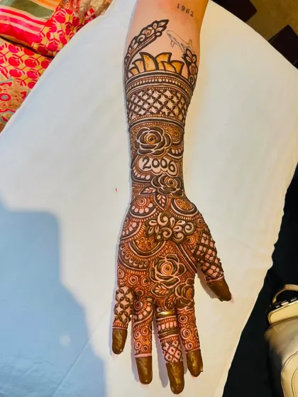 A custom bridal design for my client, including her birth year '2006' and a cityscape tattoo on her arm.