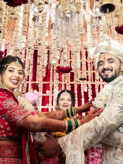 The happy couple, officially united by their varmalas. A picture of pure joy.
