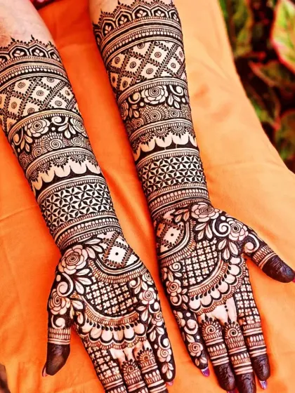 This design combines floral elements with geometric patterns for a modern yet traditional bridal mehndi. The dark stain shows the quality of our organic henna.