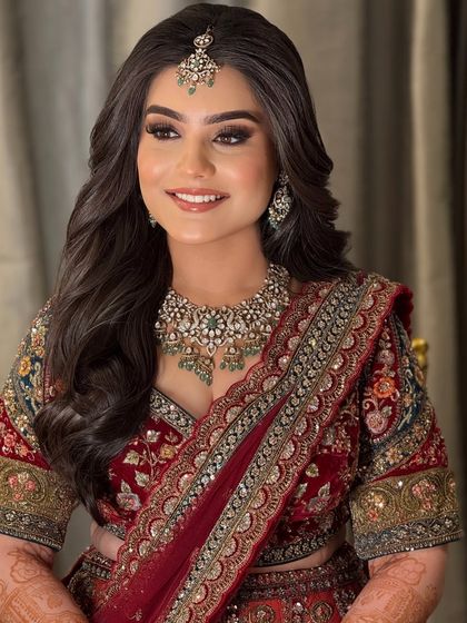 A happy, smiling portrait of the bride. The glamorous makeup enhances her features and her joyful expression.