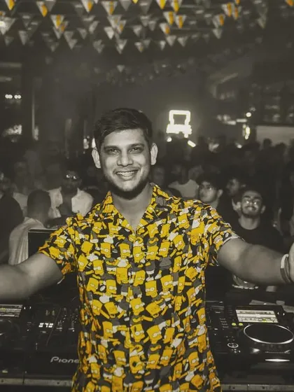 A great shot of me in a bright yellow shirt, arms open to the crowd. This photo radiates positive energy.