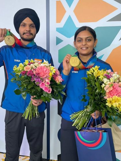 Sarabjot Singh and Divya T S of Team India with their gold medals in the 10m Air Pistol Mixed Team event at the Baku World Cup.