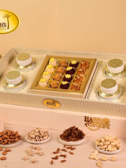 A beautiful white wicker tray hamper, complete with jars of dry fruits and a box of our assorted fusion sweets. It's a perfect gift for birthdays, anniversaries, or corporate events.