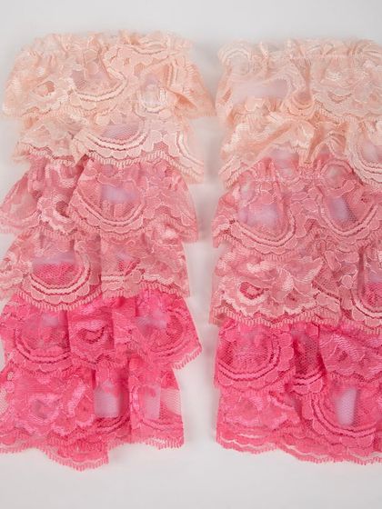 A product shot of the matching ruffled lace leg warmers.