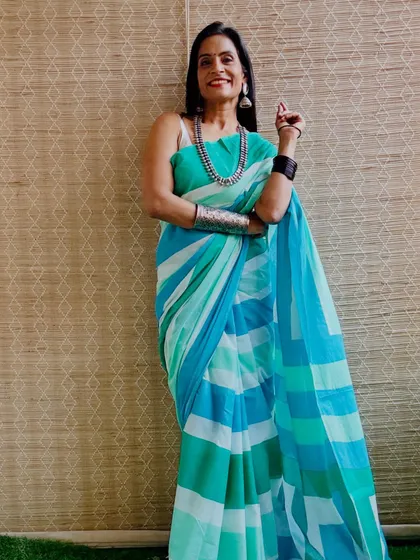 A beautiful sea-green and blue striped cotton Mulmul saree. The cool colors are very soothing and perfect for a summer day.