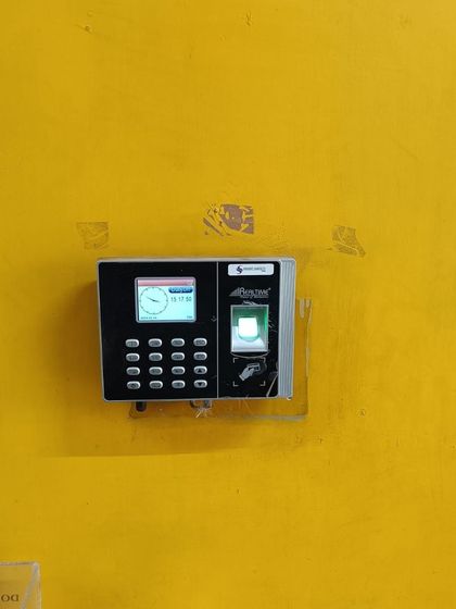 We also handle repairs. Here is a biometric attendance machine in Noida that we serviced and re-installed, ensuring it's back in perfect working condition.