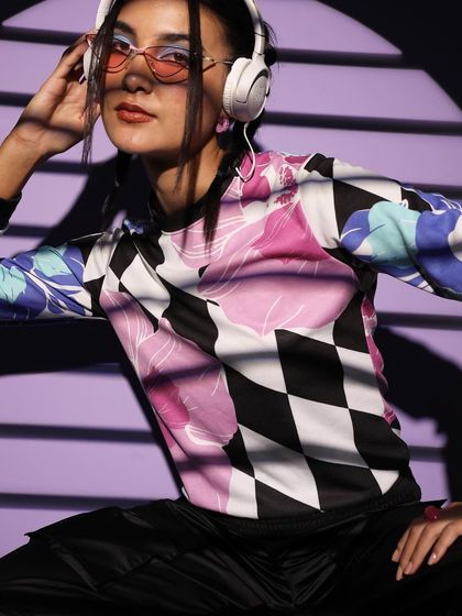 For this streetwear look, I used dramatic lighting to highlight the textures of a patterned long-sleeve top. The styling with cargo pants and retro sunglasses creates a cool, edgy vibe.