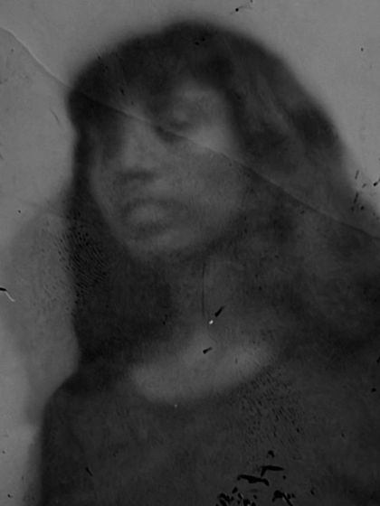 A soft, hauntingly beautiful pinhole portrait. The long exposure required for this technique often captures a sense of stillness and introspection, revealing a different side of the subject.