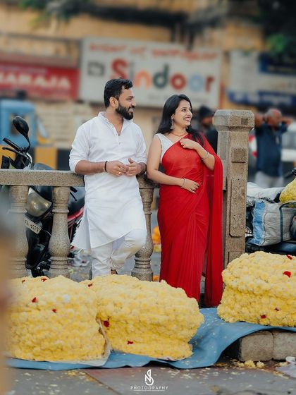 A quiet moment amidst the chaos of the flower market. The vibrant yellow flowers create a stunning backdrop.