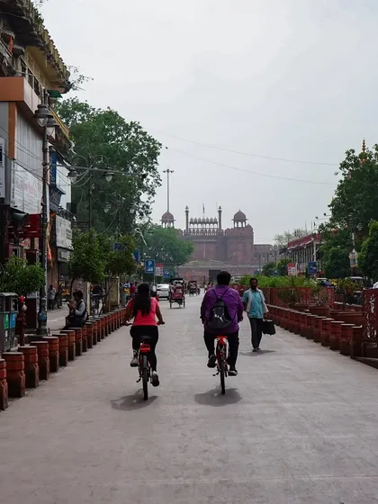 Cycling towards the magnificent Red Fort on the main street of Chandni Chowk. Seeing this iconic landmark from a bicycle offers a truly special perspective on its scale and history.