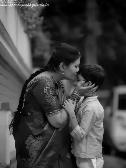 Sometimes, a simple black and white photograph can convey the most emotion. This touching portrait of a mother and her son highlights the deep bond they share, creating a timeless piece of art for their family.