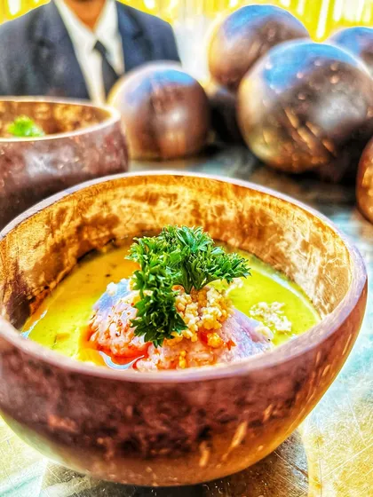 This dish features fragrant Blue Jasmine Rice paired with a creamy Vietnamese curry, served in a rustic coconut bowl. It's an example of the authentic and beautifully presented global cuisine I offer.