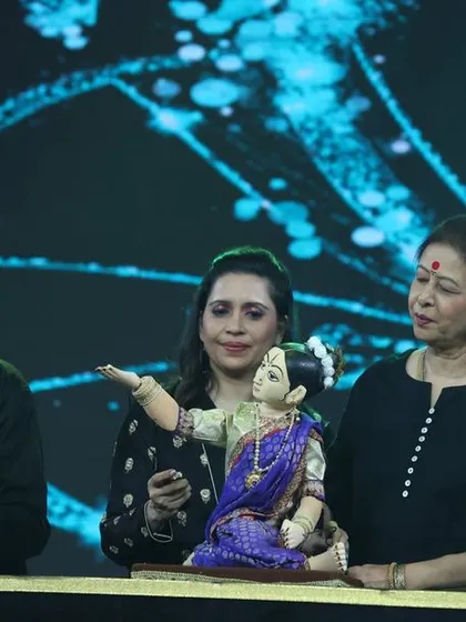 A different angle of my family performing together on stage. Passing down the skills and passion for puppetry through generations is at the core of what we do.