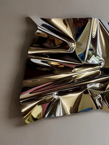 The way light hits the surface of "Meteor 67" from the side reveals the depth and complexity of its folds.