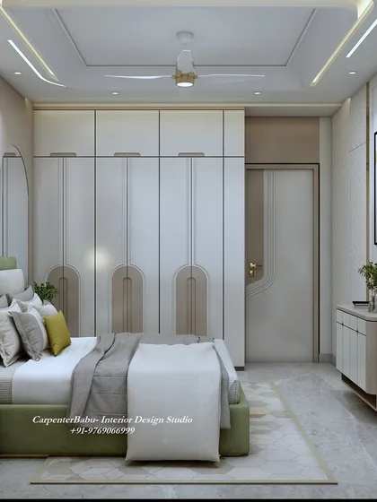 A full view of the bedroom, showing the cohesive design of the wardrobe, door, and headboard wall. The neutral color palette creates a spacious and airy feel.