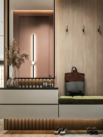 We design elegant and practical foyers that make a great first impression. This entryway features a comfortable seating bench with shoe storage, a sleek console table, and sophisticated lighting to create a warm and welcoming ambiance.