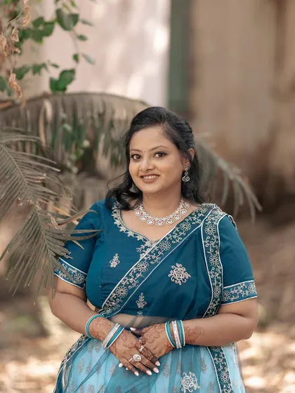 A beautiful solo portrait of the bride-to-be on her engagement day. Her smile and traditional attire radiate happiness and grace.