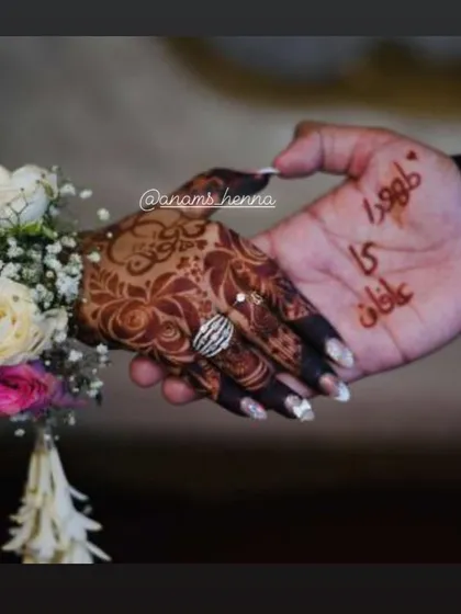 A special request from the bride to include her and her partner's names on their hands. This is a beautiful way to celebrate your union.