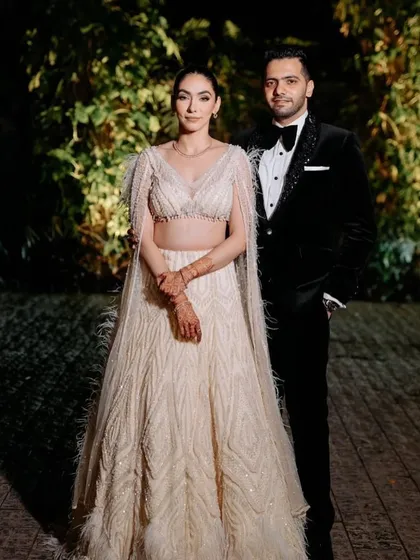 The beautiful couple, with the bride wearing our ivory embellished lehenga. A true statement of refined luxury and ethereal charm.
