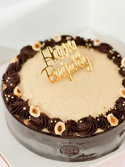 A nutty affair. This is my Hazelnut and Pistachio ganache cake, a rich and mouthwatering experience that's completely eggless and made without maida.