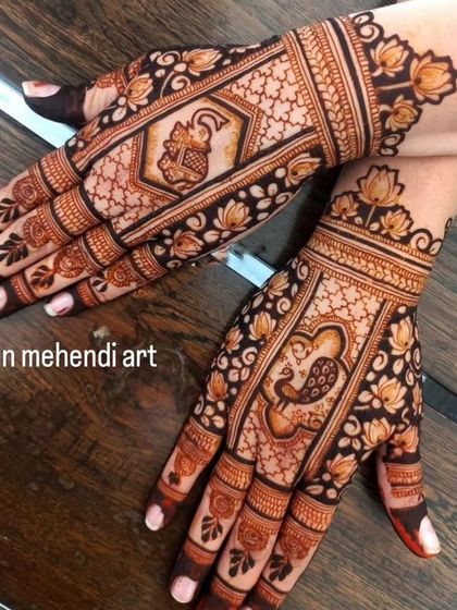 This back-hand design features bold, traditional motifs like the elephant and peacock, surrounded by a delicate lotus border.