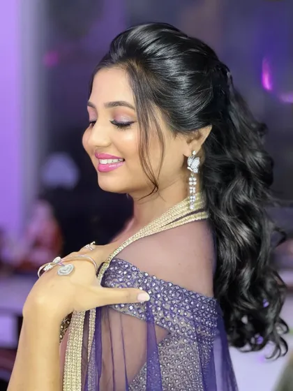 A side profile showing the elegant makeup and hairstyle.