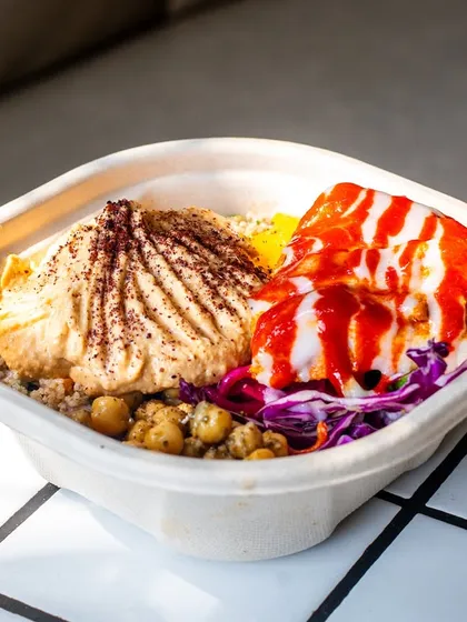 A healthy bowl from Project Hum, captured in bright sunlight that makes the ingredients look fresh and vibrant.